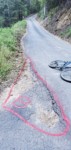 Seems cars cut the corner driving over this dirt area ... then make a nicer transition on the existing asphalt?