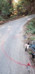 This is a sunken area where water stands.  WORSE, we have a major erosion problem where water drains into chasm, eroding away our roadbed (small channel on right).