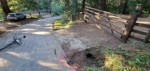 Seems cars cut the corner driving over this dirt area when passing