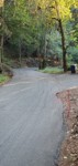 Cars cut the corner driving over this dirt area when passing, using Manfredi driveway as a turnout?